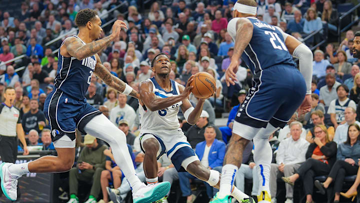 Anthony Edwards considers a shot against the Dallas Mavericks.