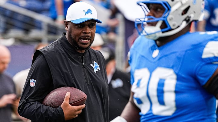 Detroit Lions defensive line coach Kacy Rogers watches warm-ups ahead of the Hall of Fame Game at Tom Benson Hall of Fame Stadium in Canton, Ohio on Thursday, July 31, 2025.