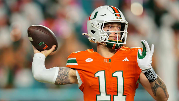 Oct 17, 2025; Miami Gardens, Florida, USA; Miami Hurricanes quarterback Carson Beck (11) throws the football against the Louisville Cardinals during the second quarter at Hard Rock Stadium. Mandatory Credit: Sam Navarro-Imagn Images