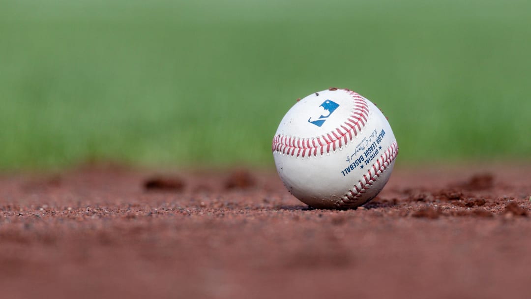 Jul 27, 2025; San Francisco, California, USA; A MLB baseball sits on the infield during the game between the San Francisco Giants and the New York Mets at Oracle Park. Mandatory Credit: Bob Kupbens-Imagn Images