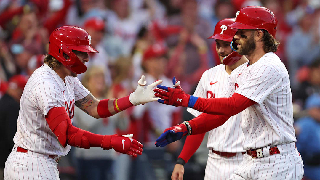 Oct 11, 2023; Philadelphia, Pennsylvania, USA; Philadelphia Phillies first baseman Bryce Harper (3) celebrates with second baseman Bryson Stott (5) after hitting a three run home run during the third inning against the Atlanta Braves in game three of the NLDS for the 2023 MLB playoffs at Citizens Bank Park.