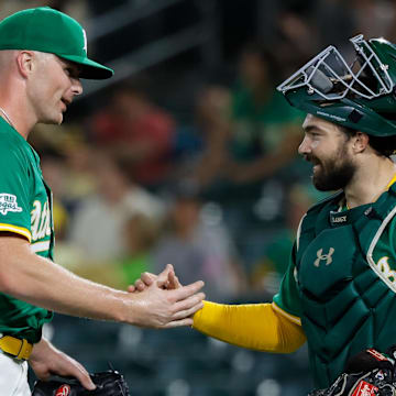 Aug 1, 2025; West Sacramento, California, USA; Athletics pitcher Sean Newcomb (31) shakes hands with pitcher Zac Gallen (23) after the game against the Arizona Diamondbacks at Sutter Health Park. Mandatory Credit: Sergio Estrada-Imagn Images