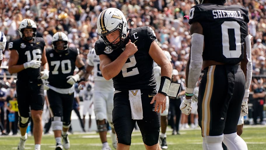 Vanderbilt quarterback Diego Pavia (2) celebrates his touchdown against Utah State.