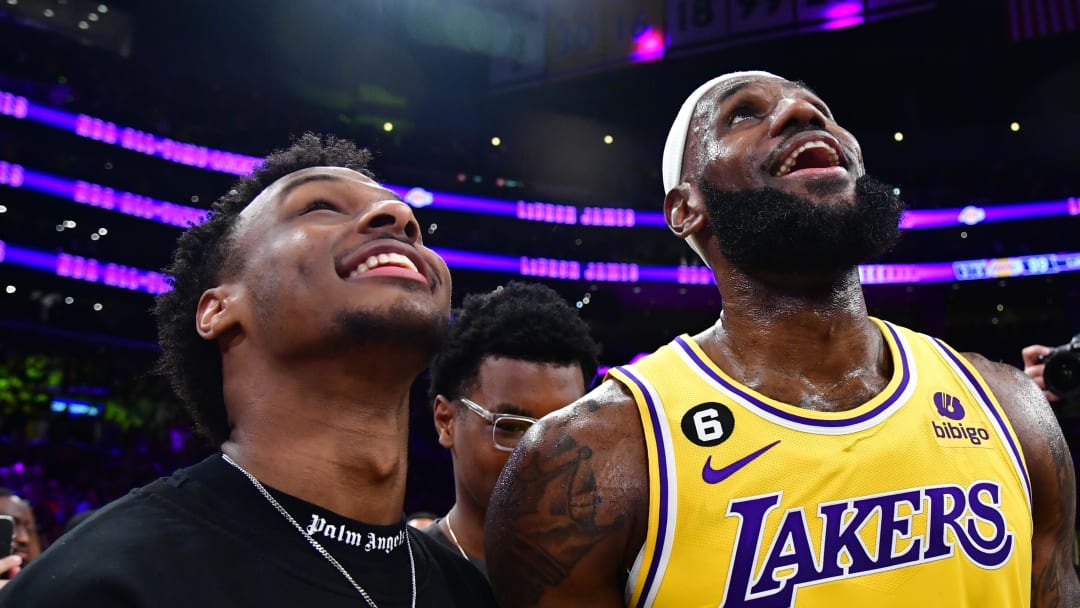 Feb 7, 2023; Los Angeles, California, USA; Los Angeles Lakers forward LeBron James (6) celebrates with his son Bronny James after breaking the all-time scoring record in the third quarter against the Oklahoma City Thunder at Crypto.com Arena. Mandatory Credit: Gary A. Vasquez-USA TODAY Sports