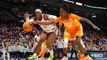 Ohio State Buckeyes forward Cotie McMahon (32) and Tennessee Vols guard Talaysia Cooper (55) battle for a loose ball in the second round of the women's NCAA Tournament.