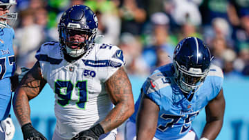 Seattle Seahawks defensive tackle Byron Murphy II (91) celebrates a sack of Tennessee Titans quarterback Cam Ward (1) during the second quarter at Nissan Stadium in Nashville, Tenn., Sunday, Nov. 23, 2025.