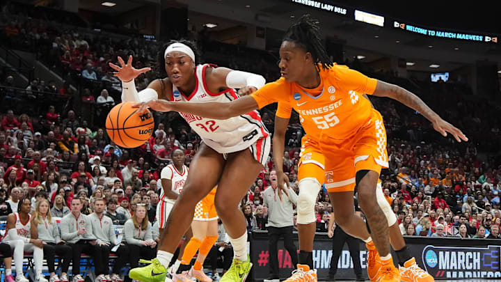 Ohio State Buckeyes forward Cotie McMahon (32) and Tennessee Vols guard Talaysia Cooper (55) battle for a loose ball in the second round of the women's NCAA Tournament.