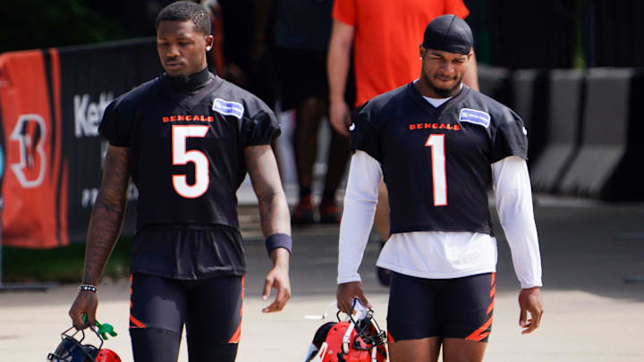 Cincinnati Bengals wide receiver Tee Higgins (5) and Cincinnati Bengals wide receiver Ja'Marr Chase (1) walk to the practice field, Wednesday, Sept. 4, 2024, in Cincinnati.