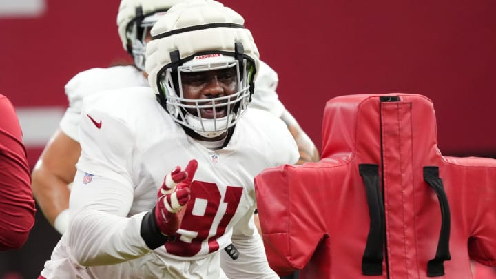 Arizona Cardinals defensive lineman L.J. Collier (91) runs through a drill during training camp at State Farm Stadium in Glendale, Ariz., on Monday, July 29, 2024.