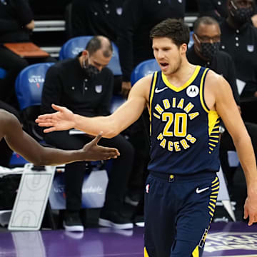 Jan 11, 2021; Sacramento, California, USA; Indiana Pacers guard Victor Oladipo (4) high fives forward Doug McDermott (20) after a play against the Sacramento Kings during the fourth quarter at Golden 1 Center. Mandatory Credit: Kelley L Cox-Imagn Images