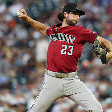 Jun 20, 2025; Denver, Colorado, USA; Arizona Diamondbacks starting pitcher Zac Gallen (23) delivers a pitch in the fifth inning against the Colorado Rockies at Coors Field. Mandatory Credit: Ron Chenoy-Imagn Images