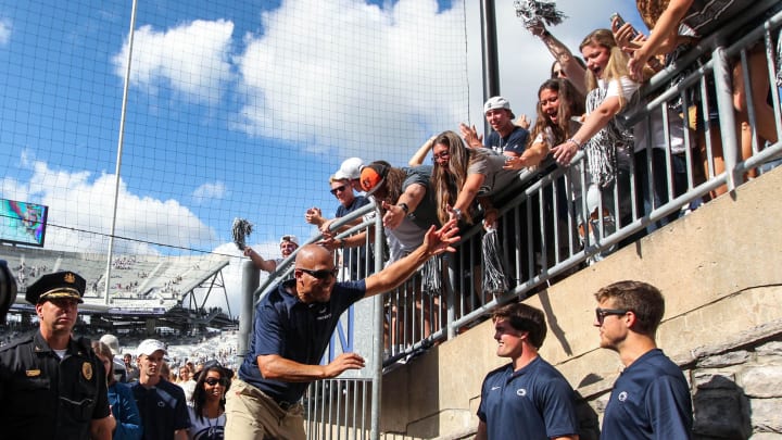 Penn State coach James Franklin celebrates with the students following a win at Beaver Stadium.