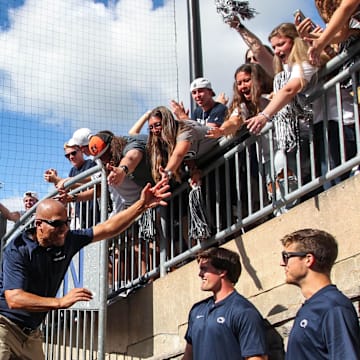 Penn State football coach James Franklin celebrates with students after a Nittany Lions victory at Beaver Stadium. 
