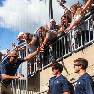 Penn State coach James Franklin celebrates with the students following a Nittany Lions victory at Beaver Stadium.