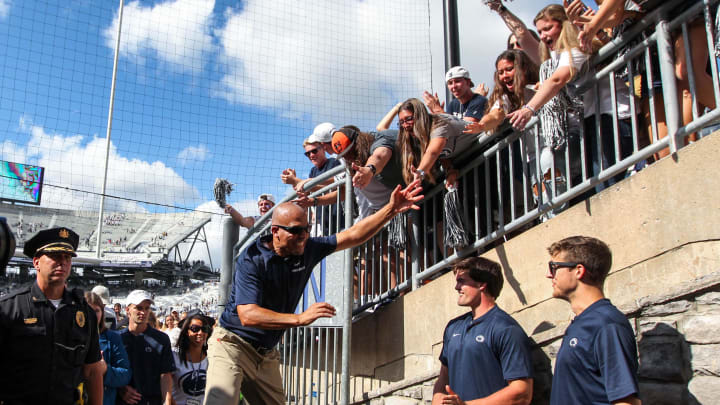 Penn State football coach James Franklin celebrates with the students following a Nittany Lions victory at Beaver Stadium. 