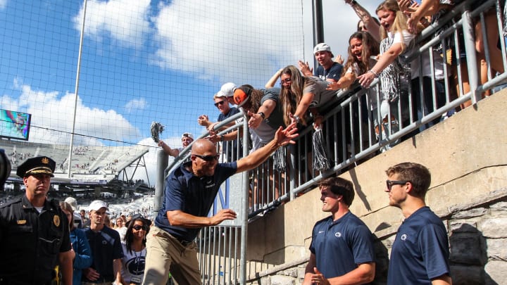 Penn State football coach James Franklin celebrates with the students following a win at Beaver Stadium. 