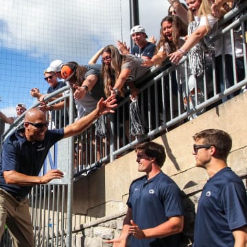 Penn State football coach James Franklin celebrates with the students following a victory at Beaver Stadium. 