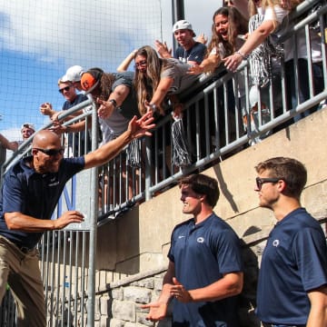 Penn State football coach James Franklin celebrates with the students following a win at Beaver Stadium. 