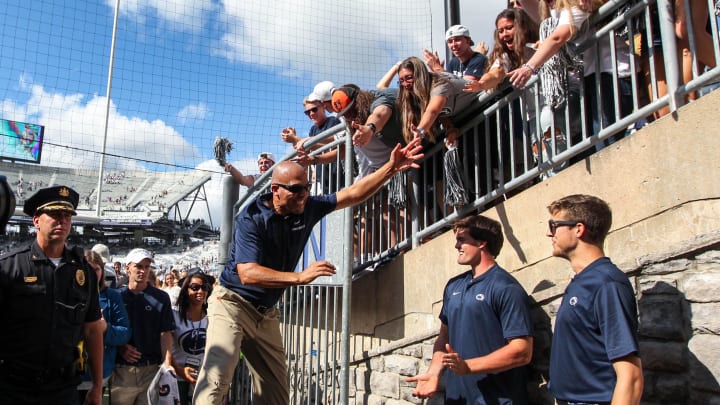 Penn State football coach James Franklin celebrates with the students following a win at Beaver Stadium. 