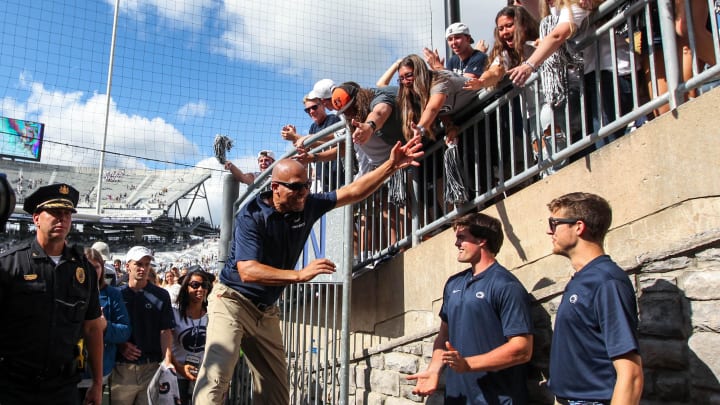 Penn State football coach James Franklin high-fives with the students following a Nittany Lions win at Beaver Stadium. 