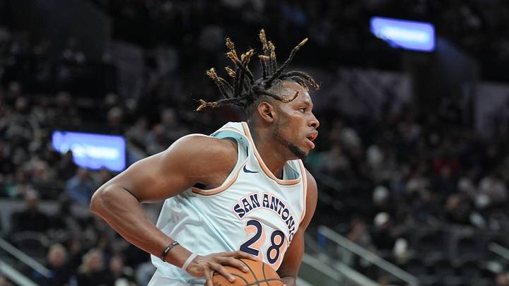 Dec 8, 2024; San Antonio, Texas, USA;  San Antonio Spurs center Charles Bassey (28) rebounds in the first half against the New Orleans Pelicans at Frost Bank Center. Mandatory Credit: Daniel Dunn-Imagn Images
