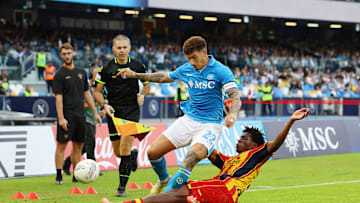 Patrick Dorgu makes a sliding challenge on Giovanni Di Lorenzo