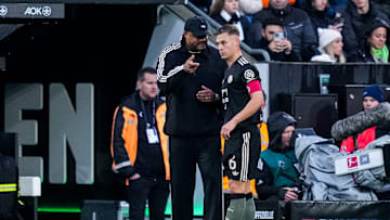 Bayern Munich head coach Vincent Kompany giving instructions to Joshua Kimmich during 3-0 win against Borussia Monchengladbach.