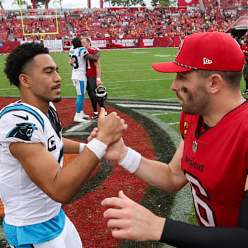 Dec 29, 2024; Tampa, Florida, USA; Tampa Bay Buccaneers quarterback Baker Mayfield (6) great Carolina Panthers quarterback Bryce Young (9) after a game at Raymond James Stadium. Mandatory Credit: Nathan Ray Seebeck-Imagn Images