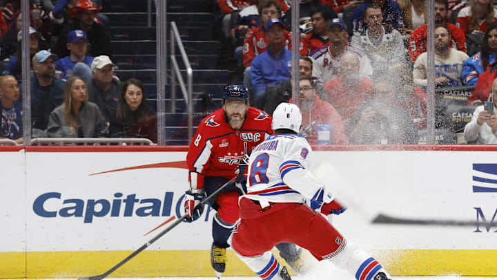 Oct 29, 2024; Washington, District of Columbia, USA; Washington Capitals left wing Alex Ovechkin (8) skates with the puck as New York Rangers defenseman Jacob Trouba (8) defends in the first period at Capital One Arena. Mandatory Credit: Geoff Burke-Imagn Images