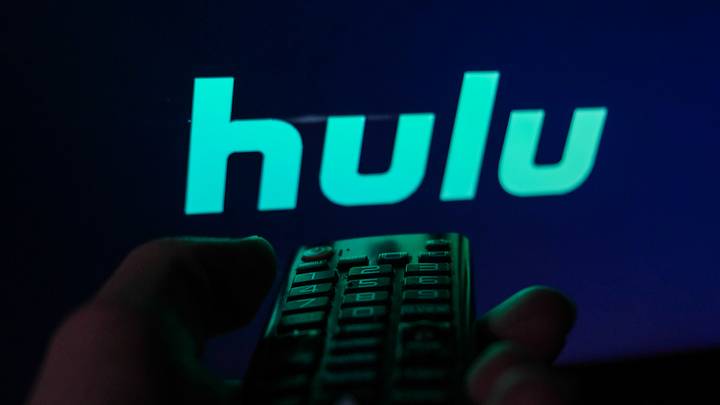 TV remote control is seen with Hulu logo displayed on a screen in this illustration photo taken in Krakow, Poland on February 6, 2022. 