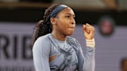 Coco Gauff celebrates winning a French Open quarterfinal match.