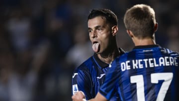 Gianluca Scamacca (L) of Atalanta BC celebrates with Charles...