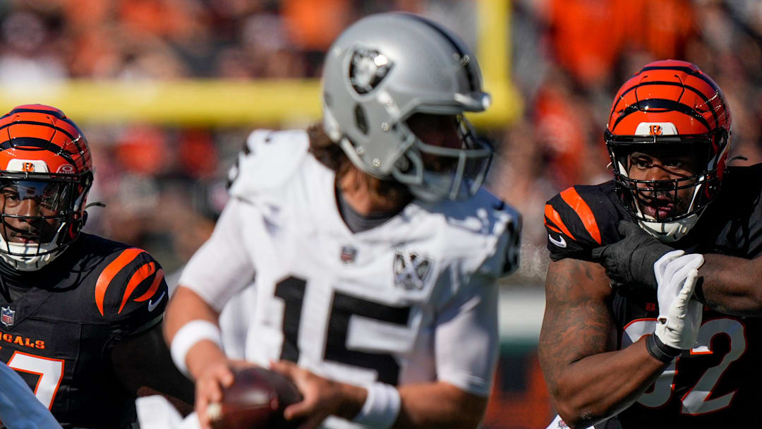 Cincinnati Bengals linebacker Germaine Pratt (57) and defensive tackle B.J. Hill (92) pursue Las Vegas Raiders quarterback Gardner Minshew (15) in the first quarter of the NFL Week 9 game between the Cincinnati Bengals and the Las Vegas Raiders at Paycor Stadium in downtown Cincinnati on Sunday, Nov. 3, 2024. Cincinnati Bengals linebacker Germaine Pratt (57) and defensive tackle B.J. Hill (92) pursue Las Vegas Raiders quarterback Gardner Minshew (15) in the first quarter of the NFL Week 9 game between the Cincinnati Bengals and the Las Vegas Raiders at Paycor Stadium in downtown Cincinnati on Sunday, Nov. 3, 2024.