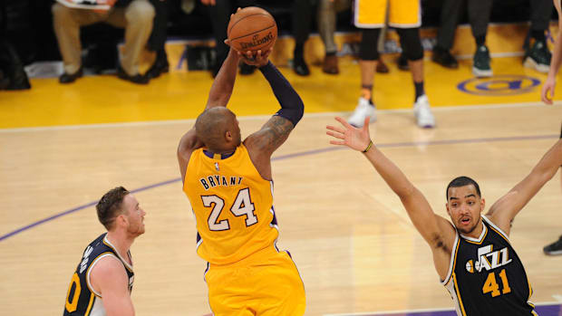 Los Angeles Lakers  forward Kobe Bryant (24) shoots against Utah Jazz forward Trey Lyles (41) 