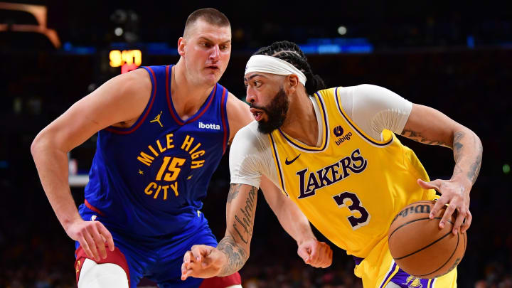 Apr 25, 2024; Los Angeles, California, USA; Los Angeles Lakers forward Anthony Davis (3) moves the ball against Denver Nuggets center Nikola Jokic (15) during the second half in game three of the first round for the 2024 NBA playoffs at Crypto.com Arena.