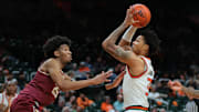 Jan 8, 2025; Coral Gables, Florida, USA; Miami Hurricanes guard Jalil Bethea (3) drives to the basket against Florida State Seminoles guard Justin Thomas (25) during the second half at Watsco Center. Mandatory Credit: Sam Navarro-Imagn Images