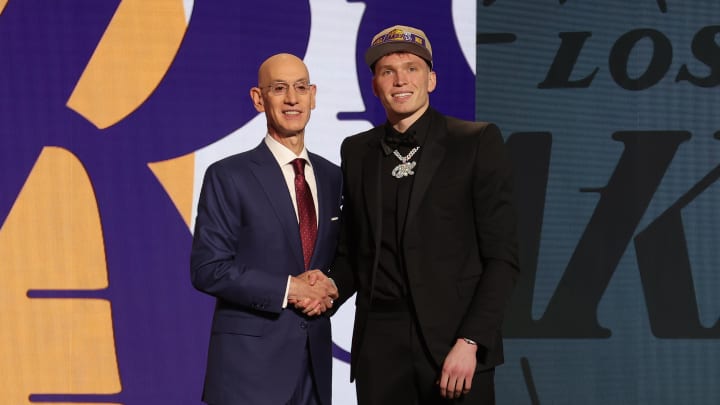 Dalton Knecht poses for photos with NBA commissioner Adam Silver after being selected in the first round by the Los Angeles Lakers.