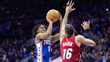 Apr 17, 2024; Philadelphia, Pennsylvania, USA; Philadelphia 76ers guard Tyrese Maxey (0) shoots past Miami Heat forward Caleb Martin (16) during the third quarter of a play-in game of the 2024 NBA playoffs at Wells Fargo Center. Mandatory Credit: Bill Streicher-USA TODAY Sports