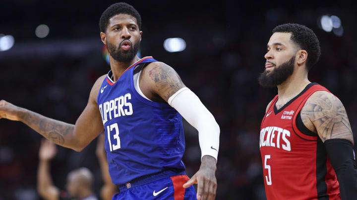 Mar 6, 2024; Houston, Texas, USA; Los Angeles Clippers forward Paul George (13) reacts after making a basket as Houston Rockets guard Fred VanVleet (5) looks on during the fourth quarter at Toyota Center. Mandatory Credit: Troy Taormina-USA TODAY Sports