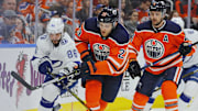 Feb 5, 2018; Edmonton, Alberta, CAN; Tampa Bay Lightning forward Nikita Kucherov (86) and Edmonton Oilers forward Leon Draisaitl (29) battle for a loose puck during the second period at Rogers Place. Mandatory Credit: Perry Nelson-Imagn Images