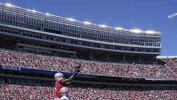 April 13, 2024; Columbus, Ohio, USA; 
Ohio State Buckeyes wide receiver Jeremiah Smith (4) playing for the scarlet team can't reel in a pass while defended by cornerback Davison Igbinosun (1) of the gray team of the during the first half of the LifeSports Spring Game at Ohio Stadium on Saturday.