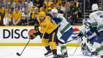 May 3, 2024; Nashville, Tennessee, USA; Nashville Predators center Ryan O'Reilly (90) passes the puck against the Vancouver Canucks during the first period in game six of the first round of the 2024 Stanley Cup Playoffs at Bridgestone Arena. Mandatory Credit: Steve Roberts-USA TODAY Sports
