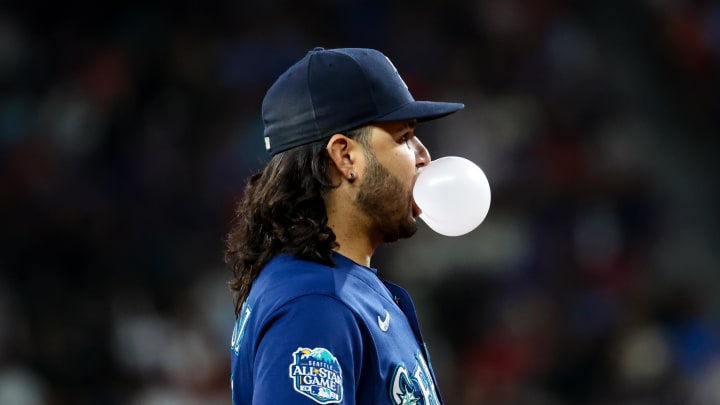 Seattle Mariners third baseman Eugenio Suarez (28) blows a bubble during the game against the Texas Rangers at Globe Life Field in 2023.