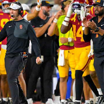 Oct 11, 2025; Los Angeles, California, USA;  USC Trojans head coach Lincoln Riley celebrates after kicker Ryon Sayeri (48) hit a 54-yard field goal in the second half against the Michigan Wolverines at United Airlines Field at the Los Angeles Memorial Coliseum. Mandatory Credit: Jayne Kamin-Oncea-Imagn Images