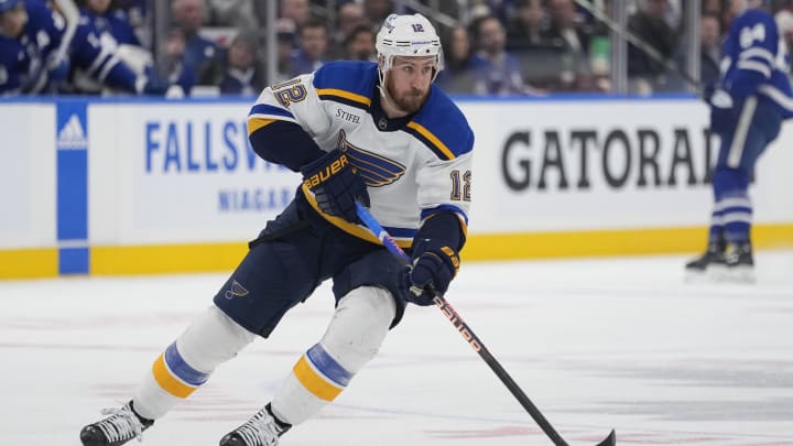 Feb 13, 2024; Toronto, Ontario, CAN; St. Louis Blues forward Kevin Hayes (12) carries the puck against the Toronto Maple Leafs during the second period Scotiabank Arena. Mandatory Credit: John E. Sokolowski-USA TODAY Sports