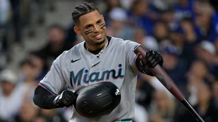 Apr 28, 2026; Los Angeles, California, USA; Miami Marlins first baseman Christopher Morel (5) smiles at the Los Angeles Dodgers bench in the first inning at Dodger Stadium. Mandatory Credit: Jayne Kamin-Oncea-Imagn Images