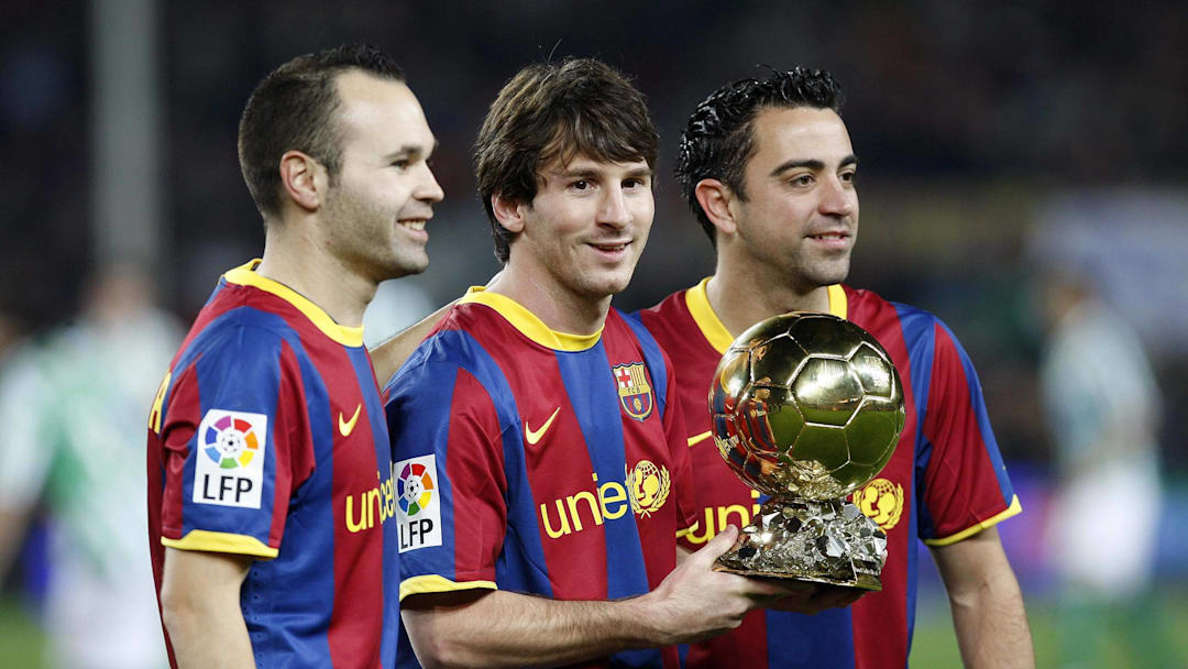 Andres Iniesta (left) Lionel Messi (middle) and Xavi Hernández made history in 2010, as for the first time ever the Ballon d'Or podium was made up of three players from the same team.