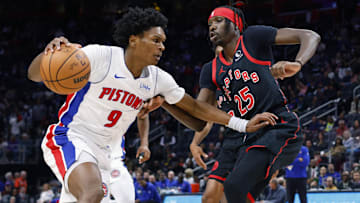 Detroit Pistons forward Ausar Thompson (9) dribbles defended by Toronto Raptors forward Chris Boucher (25) in the first half at Little Caesars Arena. Mandatory Credit: Rick Osentoski-Imagn Images