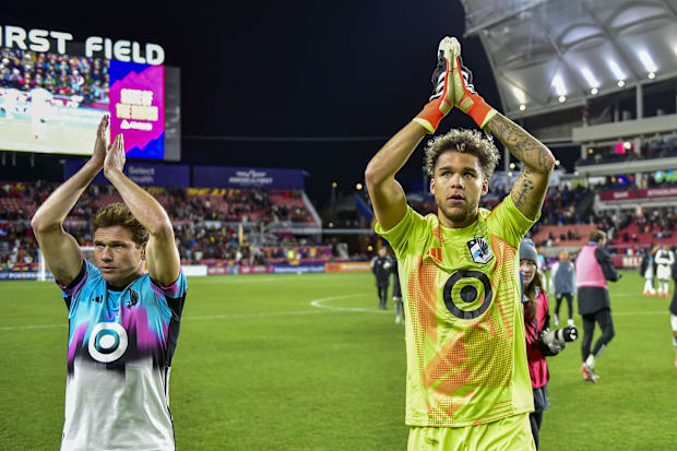 Minnesota United players celebrate after a wi