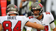Tampa Bay Buccaneers quarterback Tom Brady celebrates with tight end Cameron Brate.